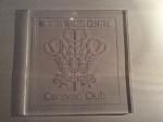 A 5mm piece of clear acrylic approx 110mm square 
Engraved 0.3 mm deep with the welsh feathers emblem 
Sorry for the poor quality pic
