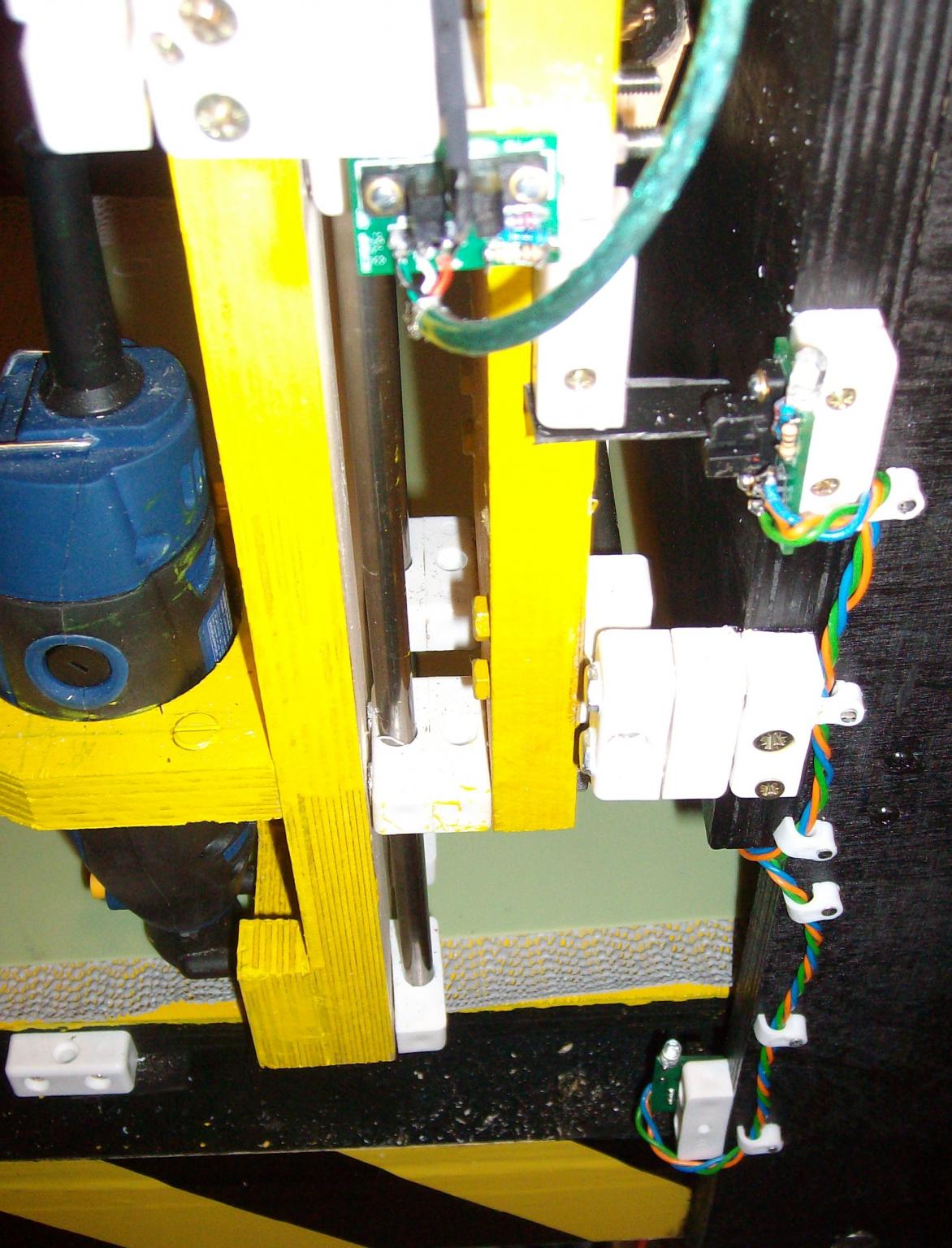 Z then  Y and at the bottom X Limit opto end-stops